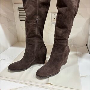 Woman’s knee-high suede boots